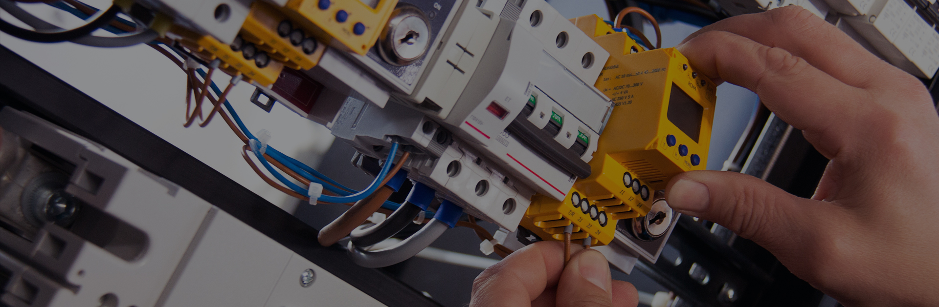 Access Electrical master electrician working in an electrical panel Access Electrical master electrician working in an electrical panel